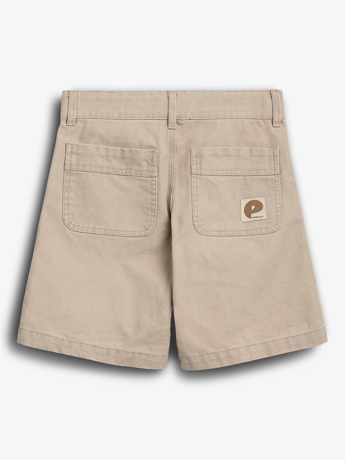 Beige shorts, lying flat with two back pockets, one featuring a small logo patch. The context is a plain white background. The logo reads: "POP TRADING COMPANY."