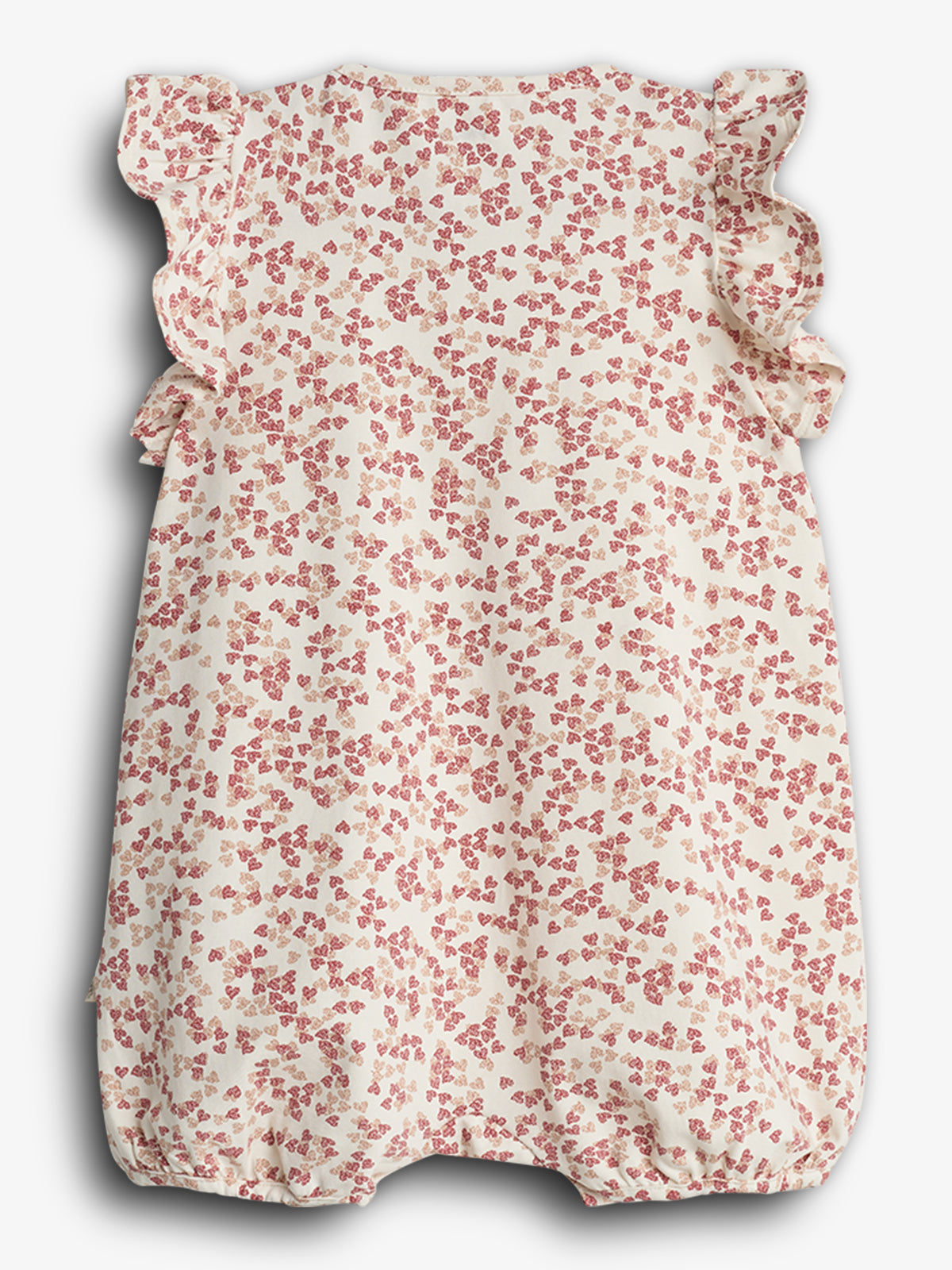 Barnedragt med rødt blomsterprint, lavet af let stof. Den har flæser ved skuldrene og elastiske kanter ved benene, og vises mod en lys baggrund.