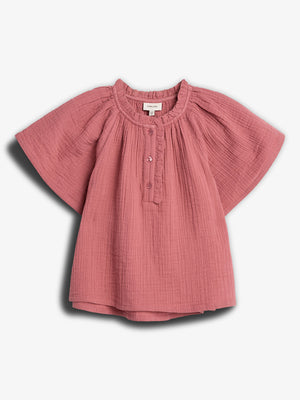 A pink, short-sleeved blouse with buttons down the front, displayed against a plain white background. It has a textured fabric and round neckline, creating a casual, soft appearance.