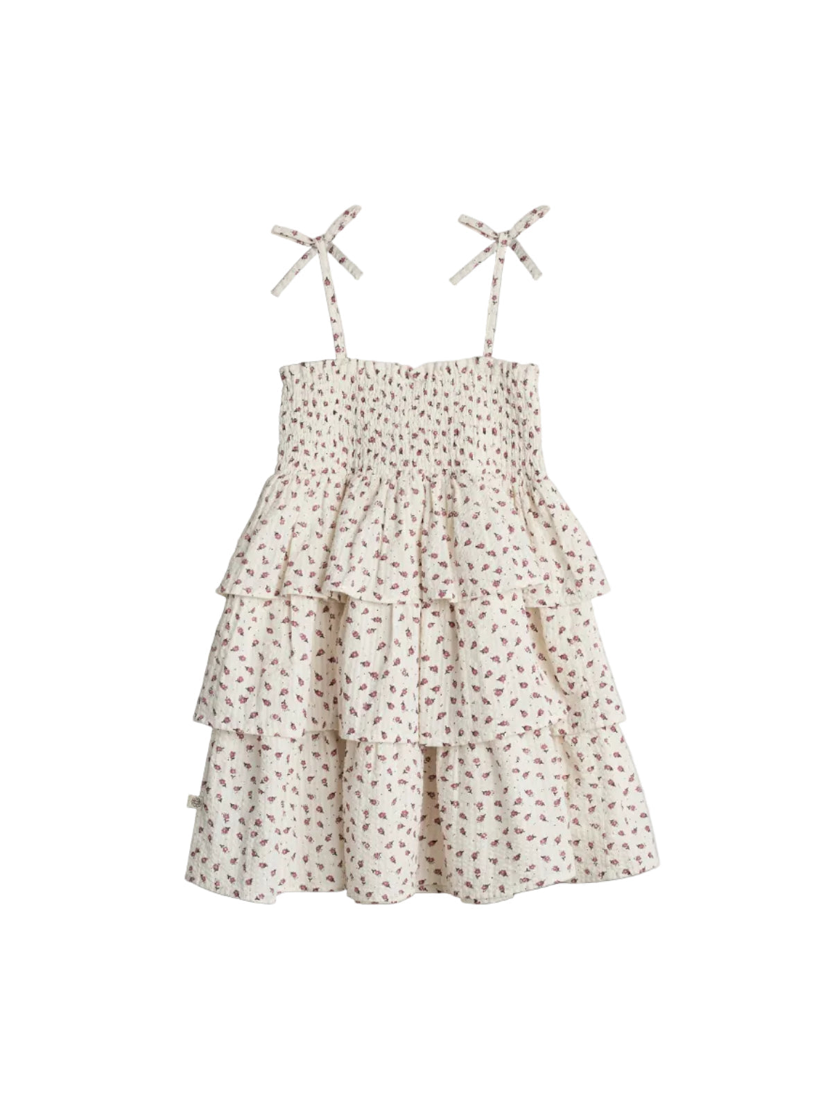 A white, floral-patterned, tiered sundress with adjustable shoulder ties, displayed on a plain background.