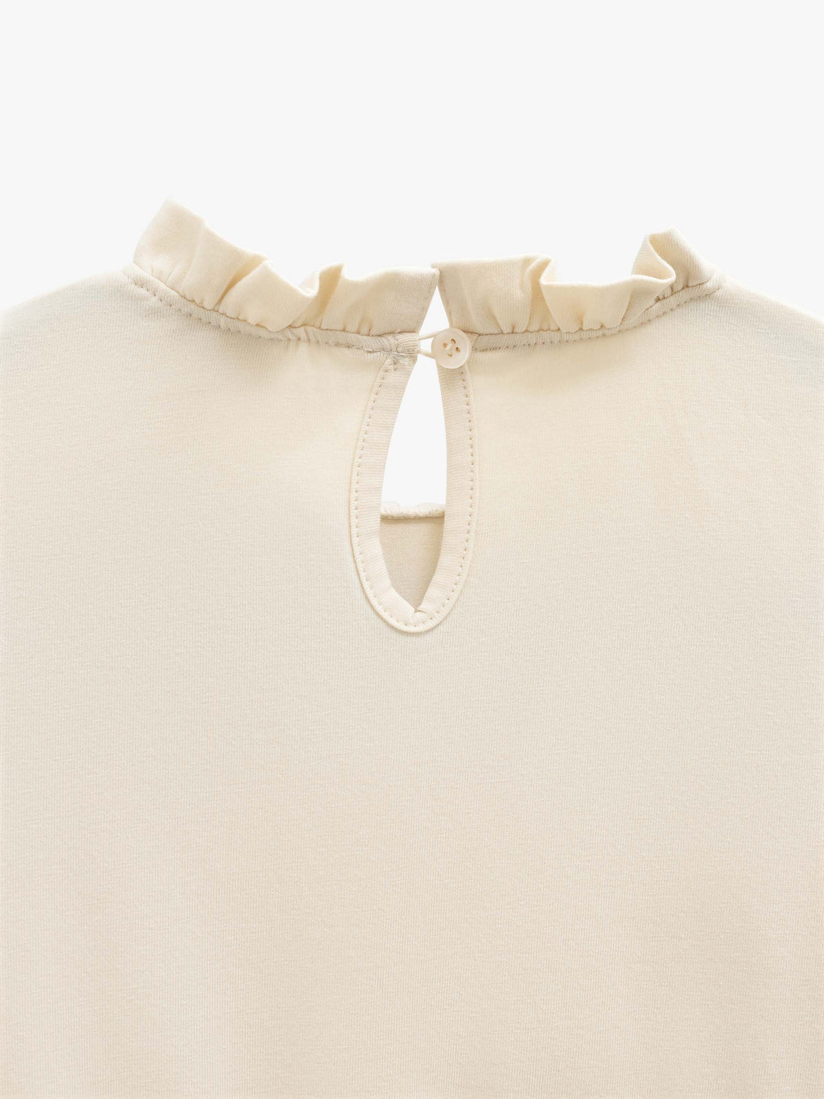 Ensfarvet jerseybluse med peplum Kids - Offwhite | 101545 Heidi
