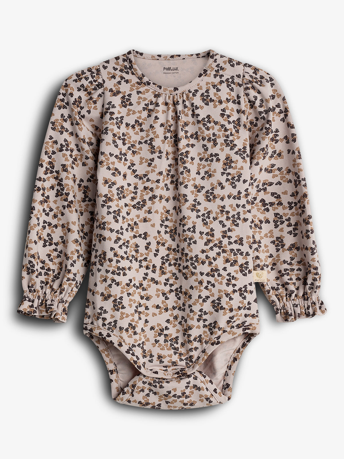 En langærmet, blomstret babydragt i beige og sorte toner ligger fladt på en lys baggrund. Øverste kant har mærket "POMPdeLUX ORGANIC COTTON." Dragtens design er enkelt og stilfuldt.