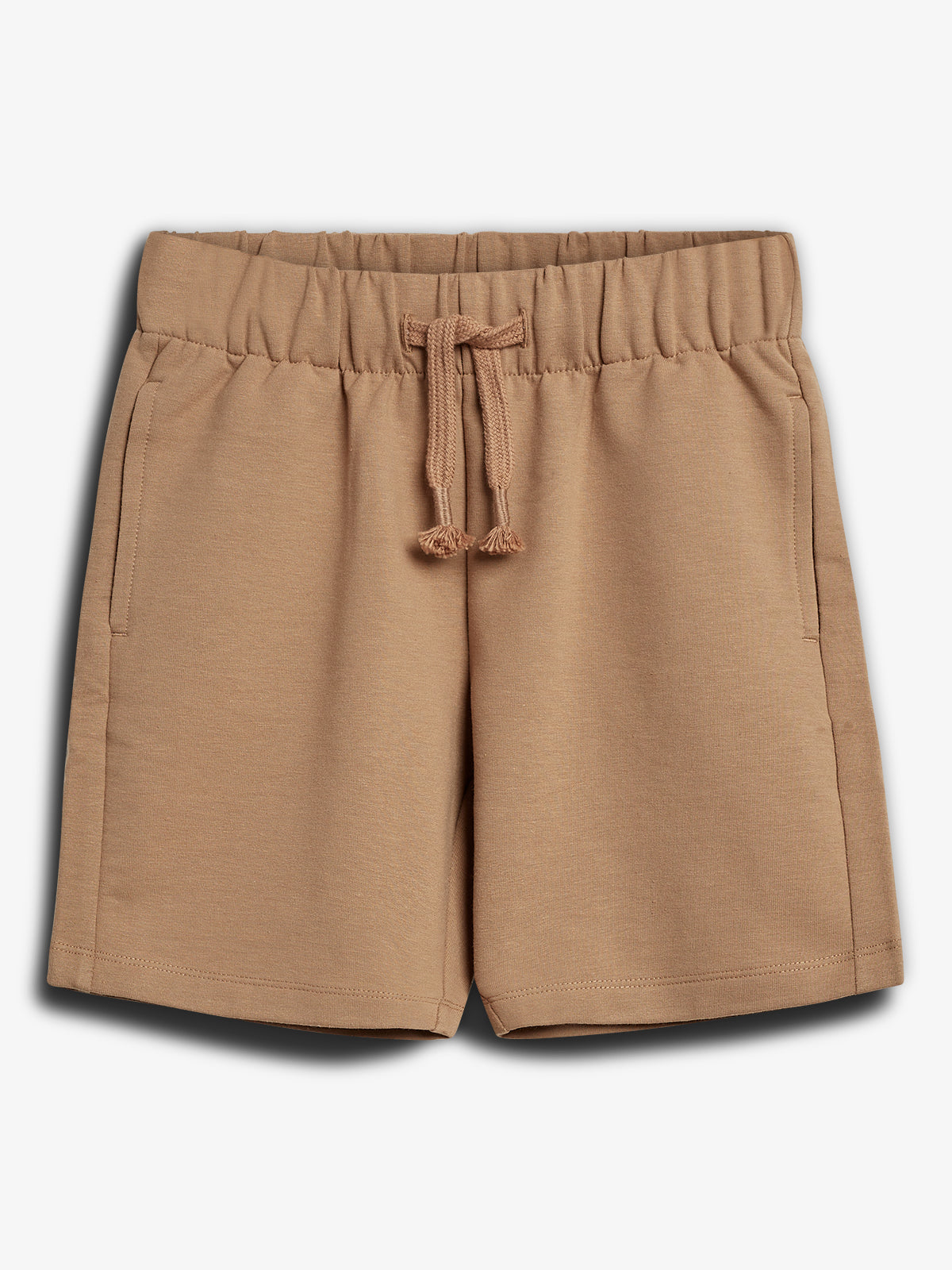 Tan shorts with elastic waistband and drawstring, featuring two side pockets, displayed on a plain white background.