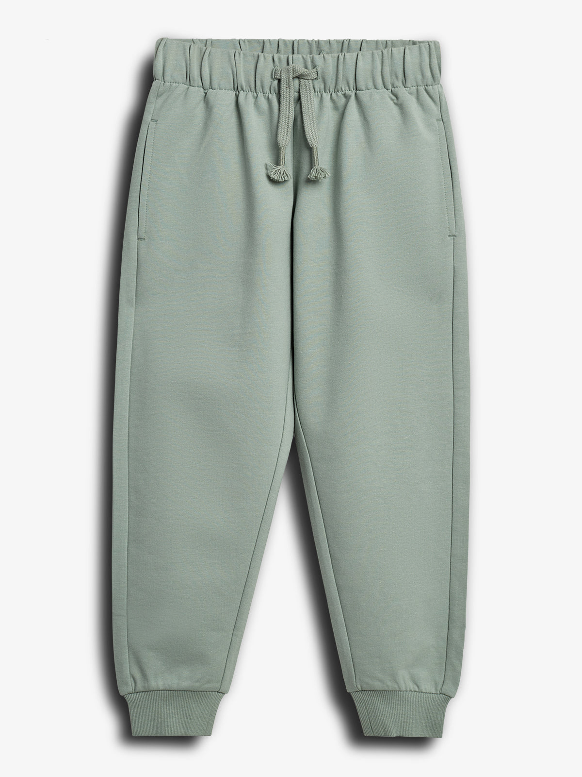Gray-green jogger pants with an elastic waistband and drawstring cords, lying flat. Ribbed ankles and side pockets are visible, set against a plain white background.