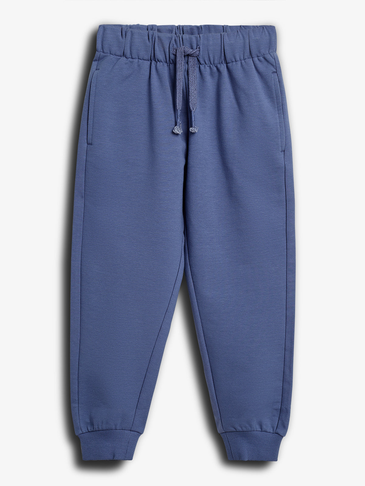 Blue sweatpants lie flat, featuring an elastic waistband with a drawstring, two side pockets, and ribbed cuffs, set against a plain white background.
