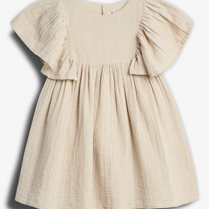 A beige children's dress with flutter sleeves and a gathered waist, made from textured fabric, displayed against a white background.