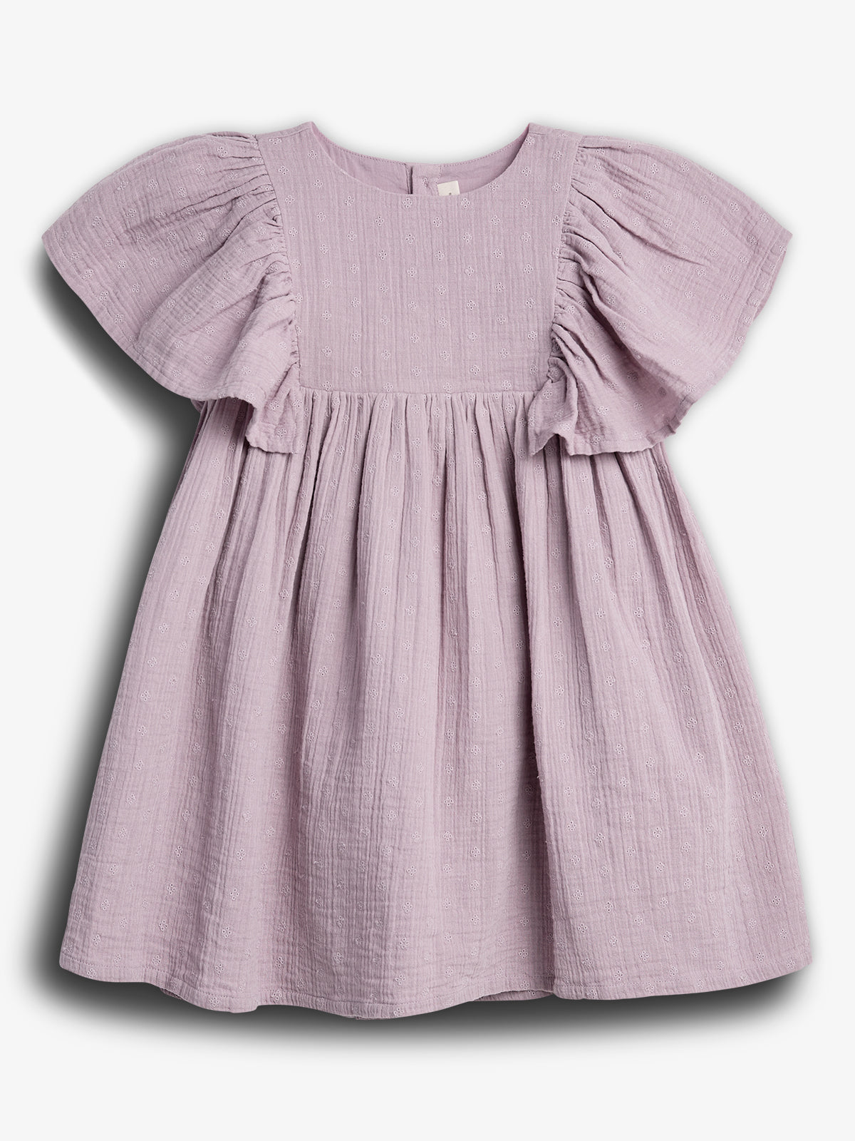 A lilac-colored, short-sleeved dress hangs against a plain white background, featuring a textured fabric with small embroidered patterns and a gathered, flowing skirt.