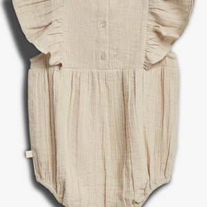A beige baby romper with buttons and ruffled sleeves is displayed flat against a white background, featuring a textured fabric with small floral patterns.