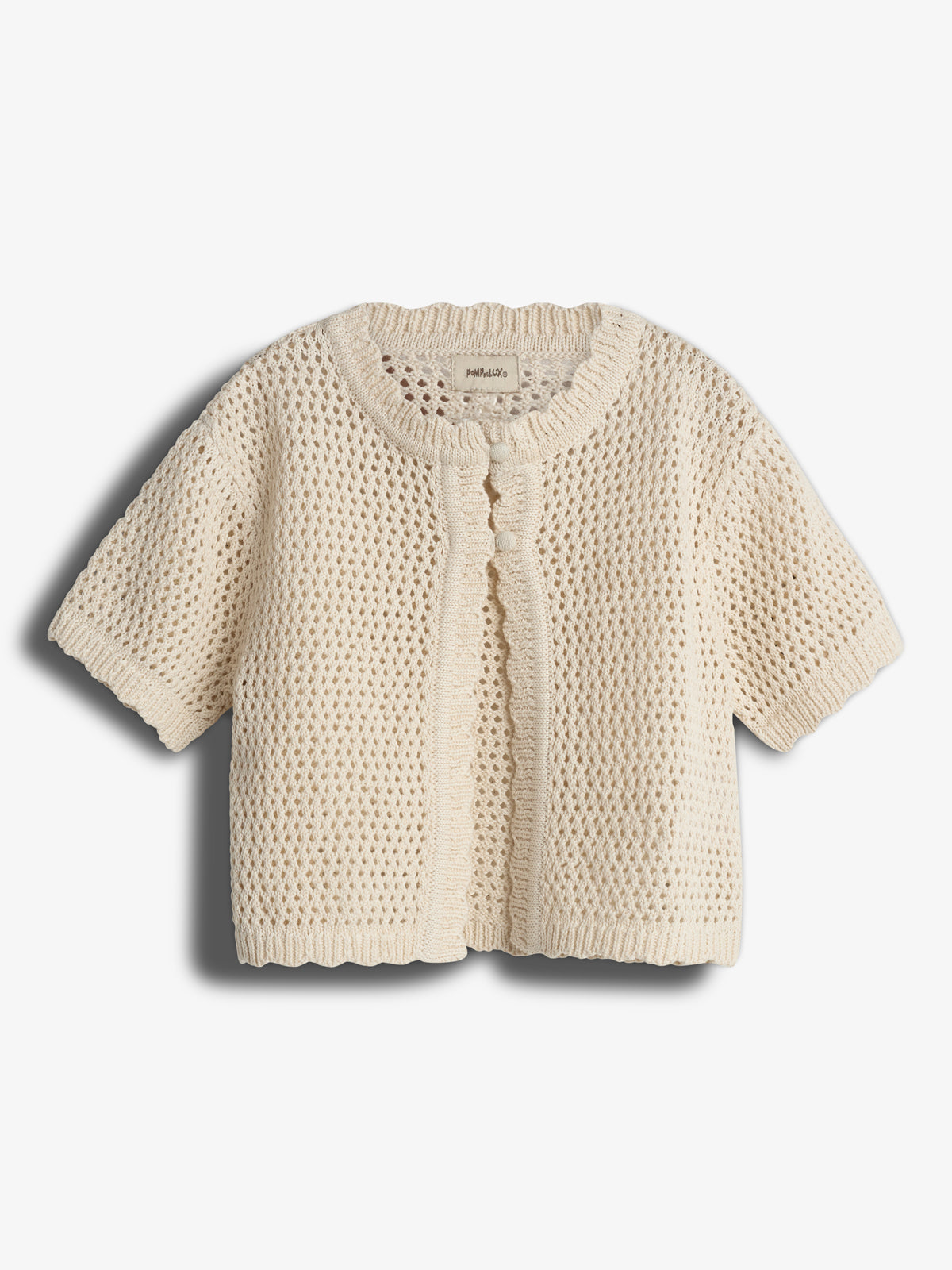 A cream-colored, short-sleeved crochet cardigan featuring a buttoned front detail is laid flat against a plain, light background. A label inside reads: "maha Lulo".