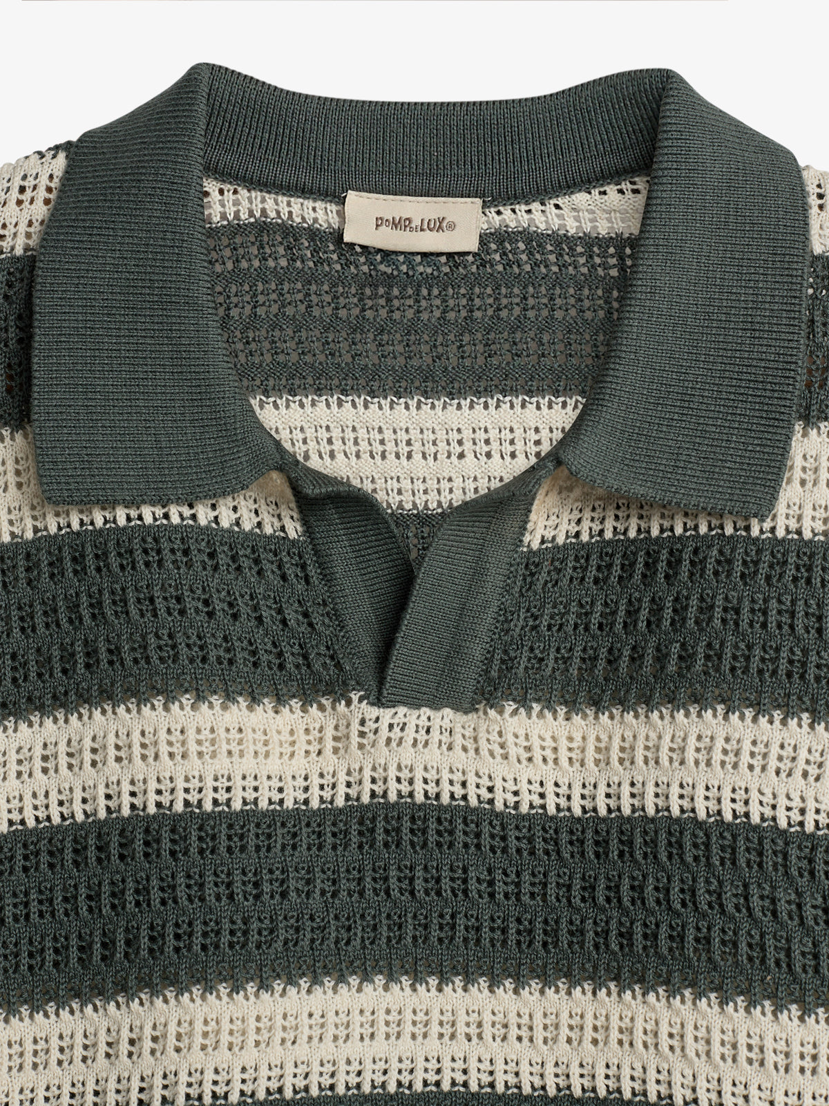 A knitted polo shirt displays alternating dark green and beige stripes with an open collar. A label inside reads "POMPdeLUX®," suggesting a brand context.