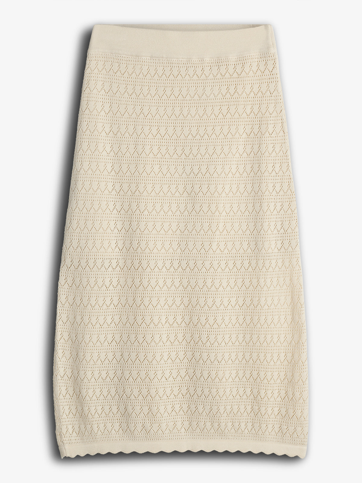 A beige, knee-length knit skirt features a geometric lace pattern, displayed flat against a plain white background.