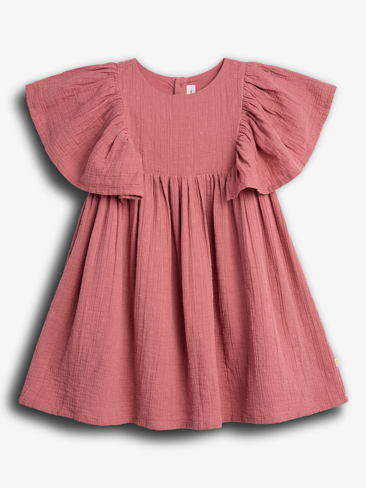 A pink, short-sleeved, textured dress hangs against a plain white background. The dress features ruffled sleeves and a gathered waist, creating a flowy silhouette.