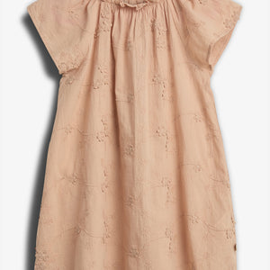 Peach-colored dress lies flat, featuring short sleeves and floral embroidery, set against a plain white backdrop.