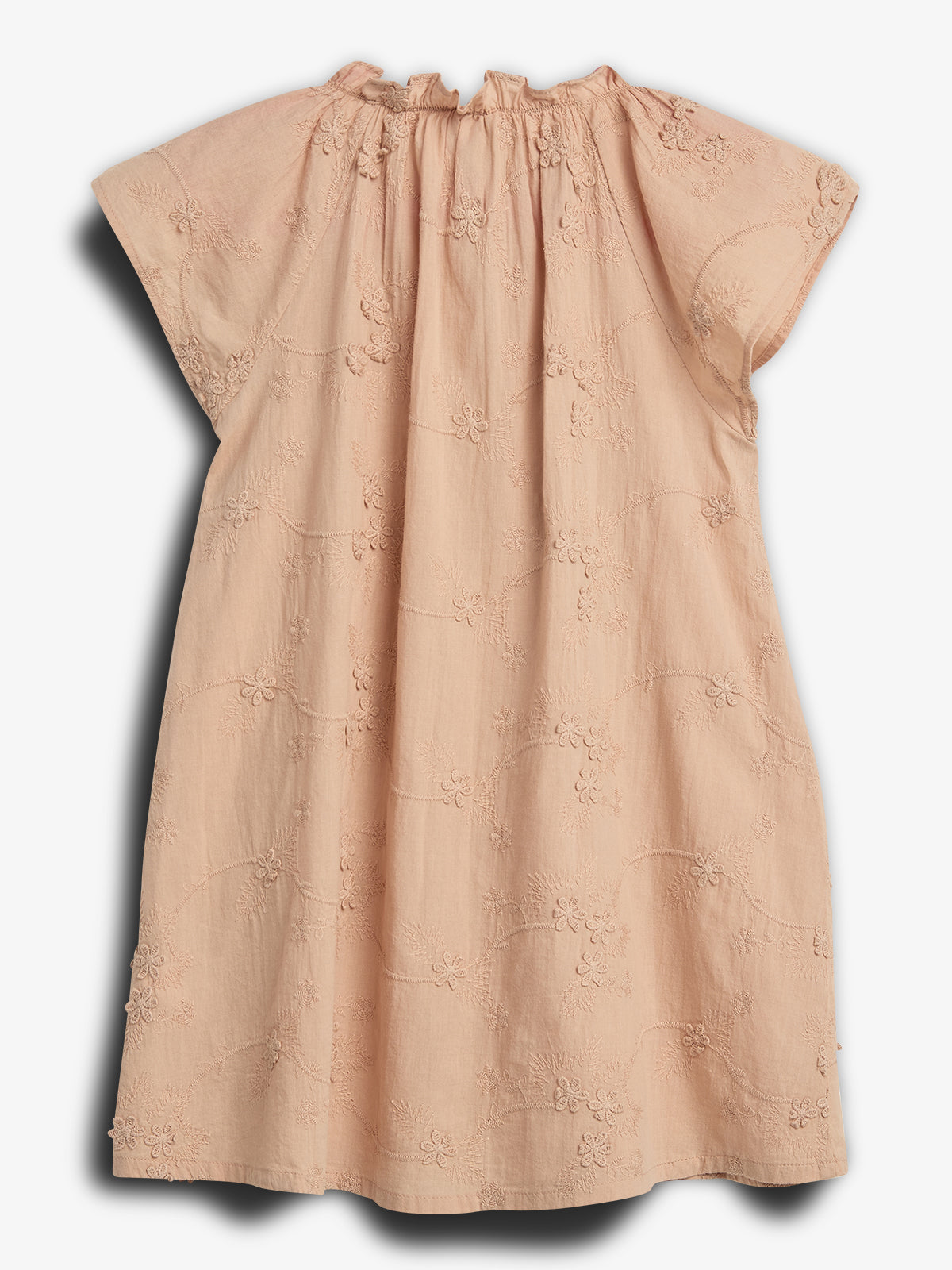 A peach-colored, short-sleeve dress features floral embroidery. It hangs freely against a plain white background, showcasing delicate, intricate designs throughout the fabric.