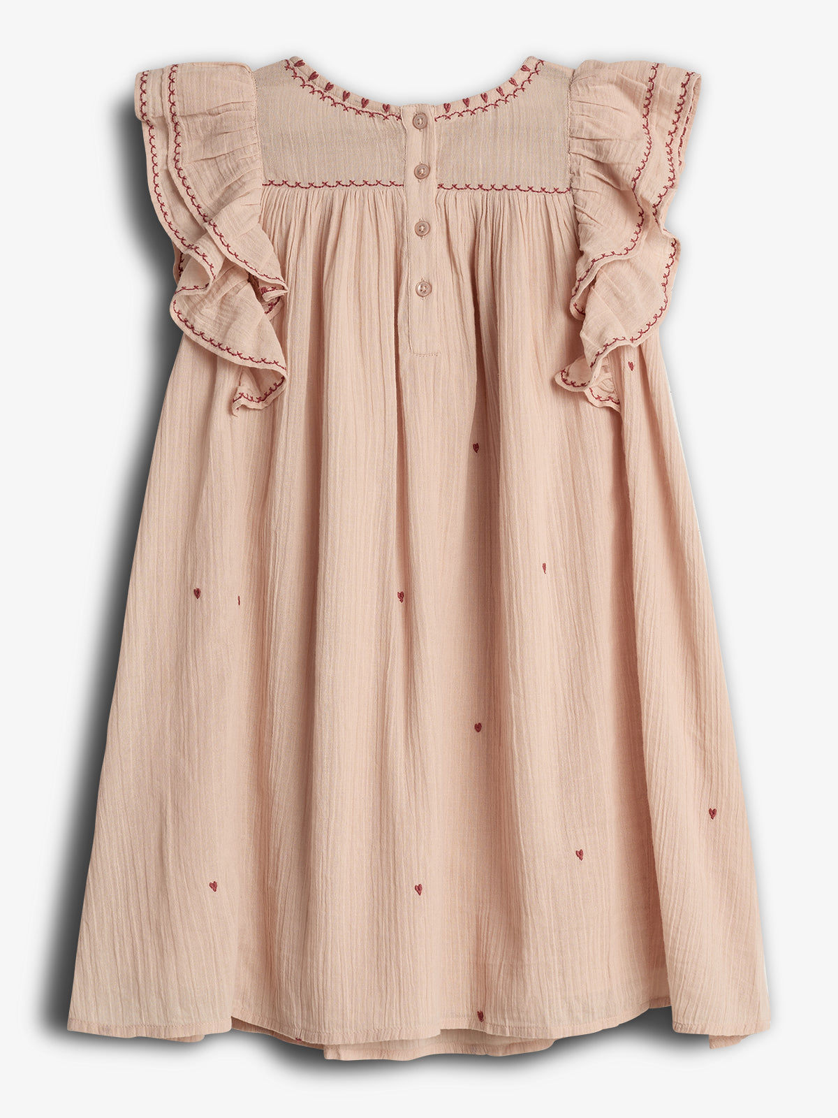 A pink children's dress adorned with red embroidered hearts and ruffled sleeves. It features button detailing on the front and decorative stitching along the neckline, hanging against a plain backdrop.