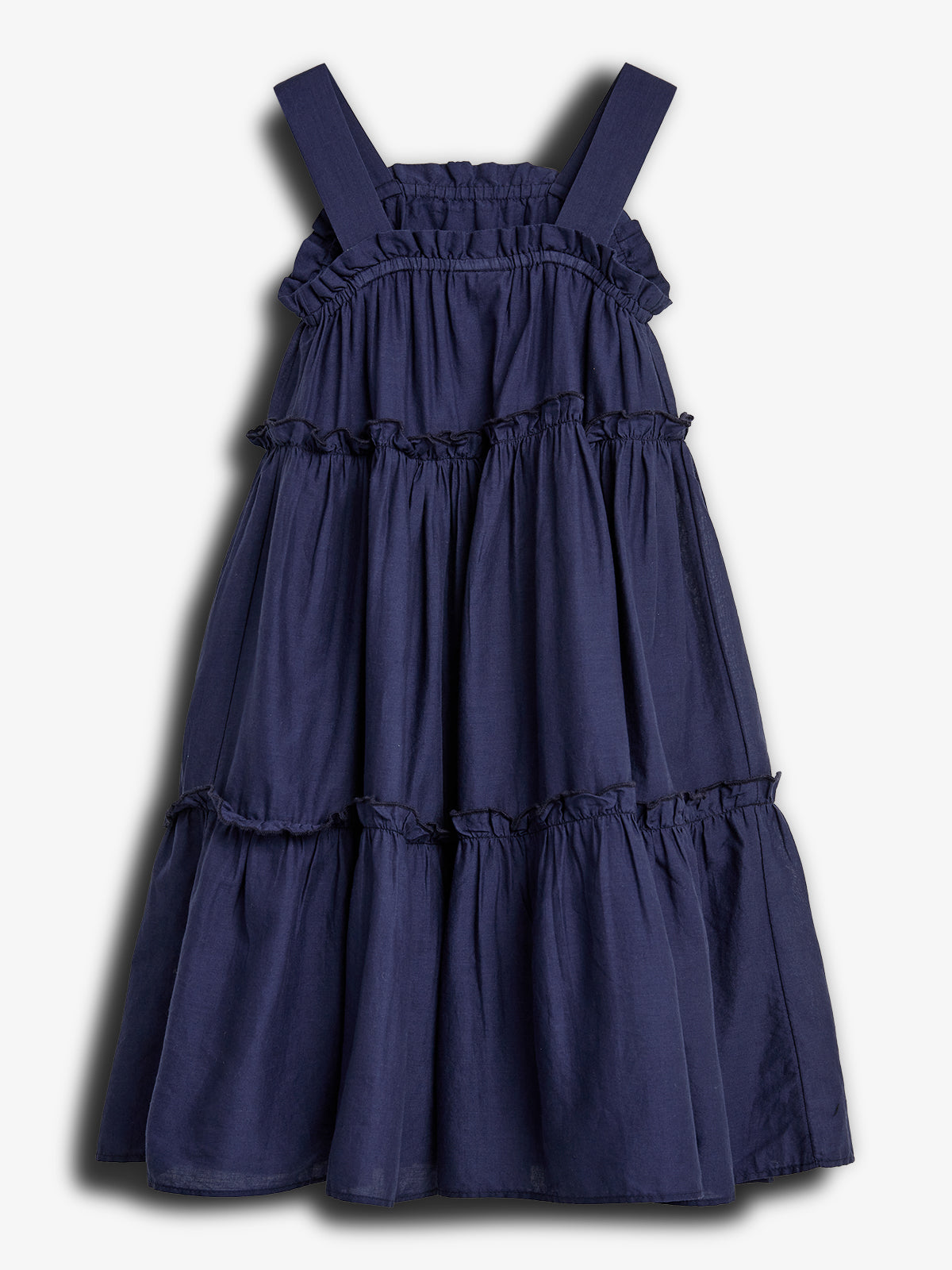 A sleeveless, dark blue dress with tiered ruffles is displayed against a plain white background. It features broad shoulder straps and a gathered, flowing style.