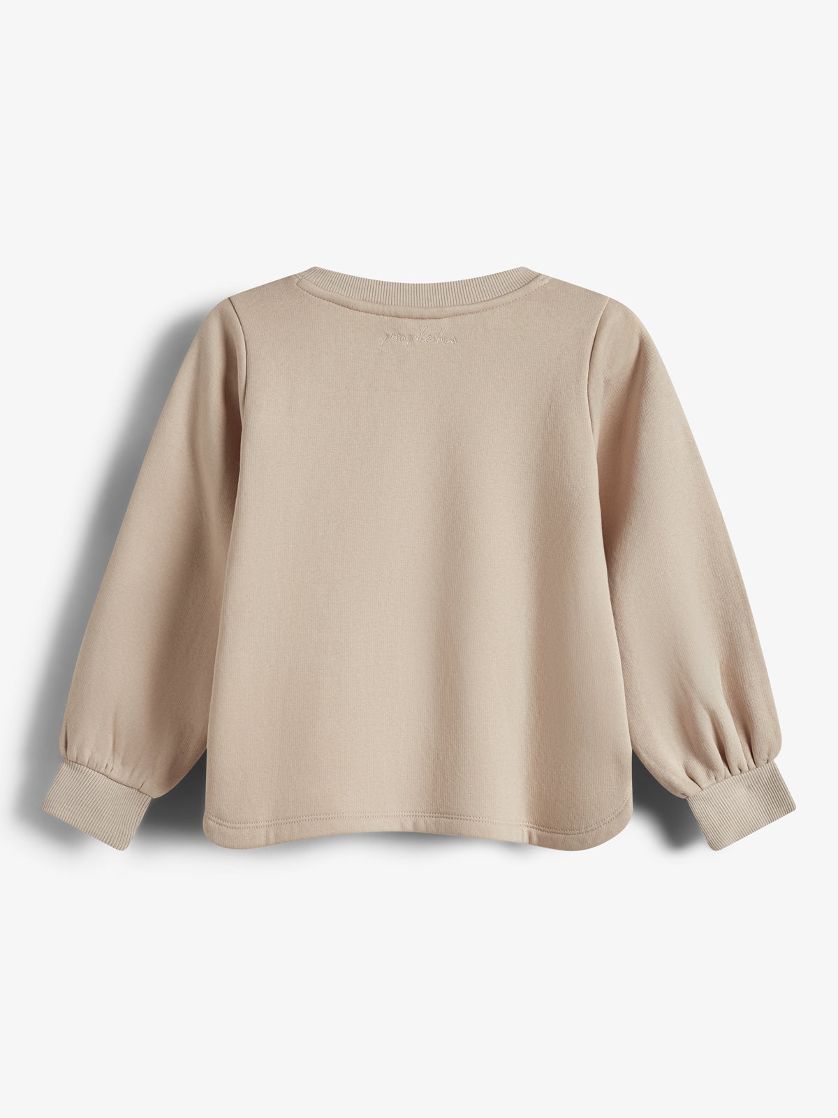 En lys beige sweatshirt ligger fladt med ryggen opad, viser lange ærmer med elastiske manchetter. Teksten "your choice" er diskret broderet øverst på ryggen. Baggrunden er hvid.