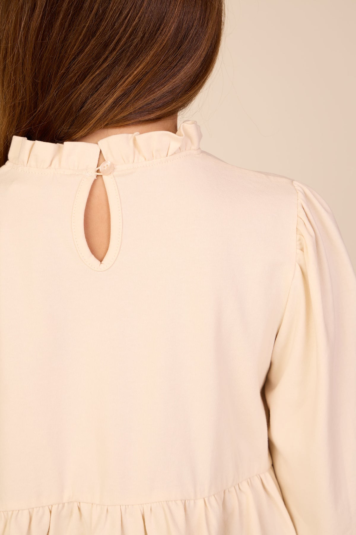 Ensfarvet jerseybluse med peplum Tween - Offwhite | 101546 Heidi